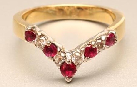 A RUBY AND DIAMOND WISHBONE RING Image