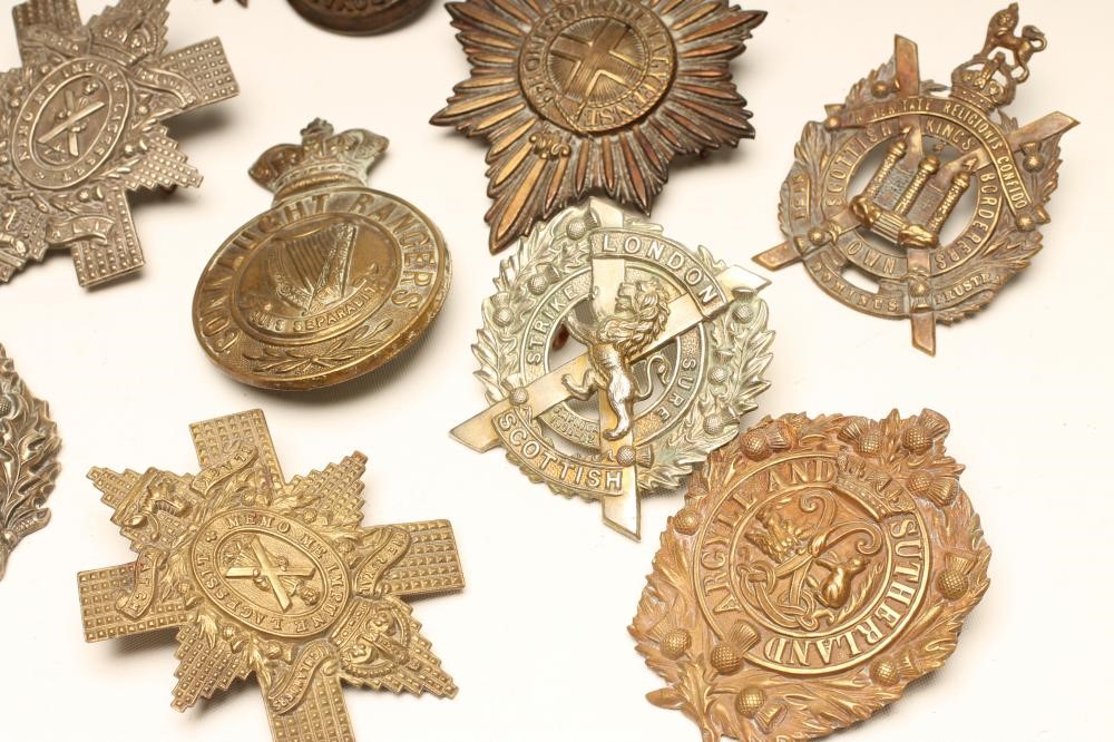 ELEVEN BRITISH MILITARY BADGES comprising eight Scottish regimental cap badges Image