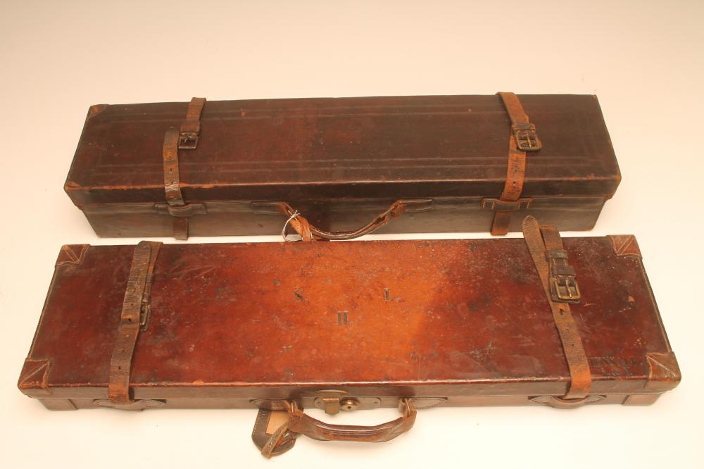 A LEATHER SHOTGUN CASE with red baize fitted interior Image