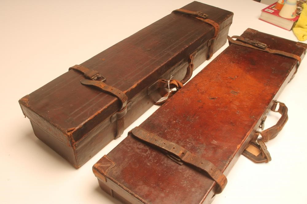 A LEATHER SHOTGUN CASE with red baize fitted interior Image