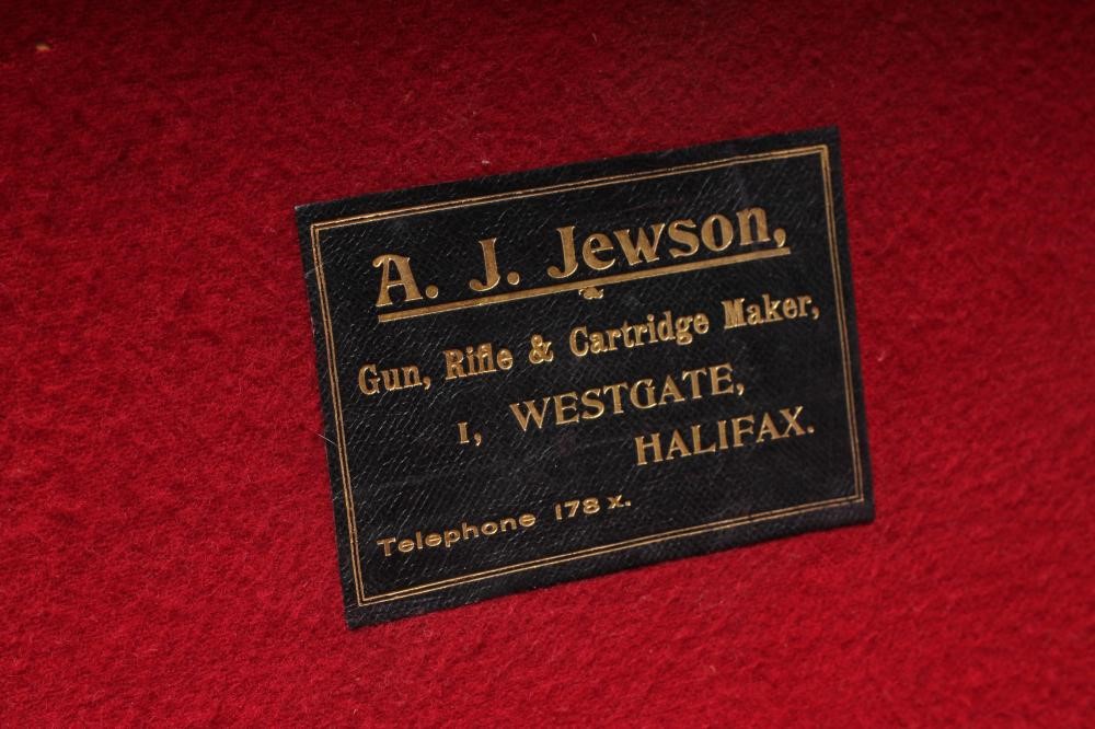 A LEATHER SHOTGUN CASE with red baize fitted interior Image