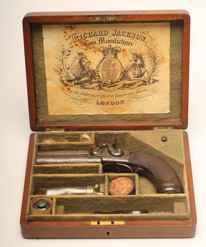 A DOUBLE BARRELLED OVER & UNDER PERCUSSION PISTOL by W. Jackson Image