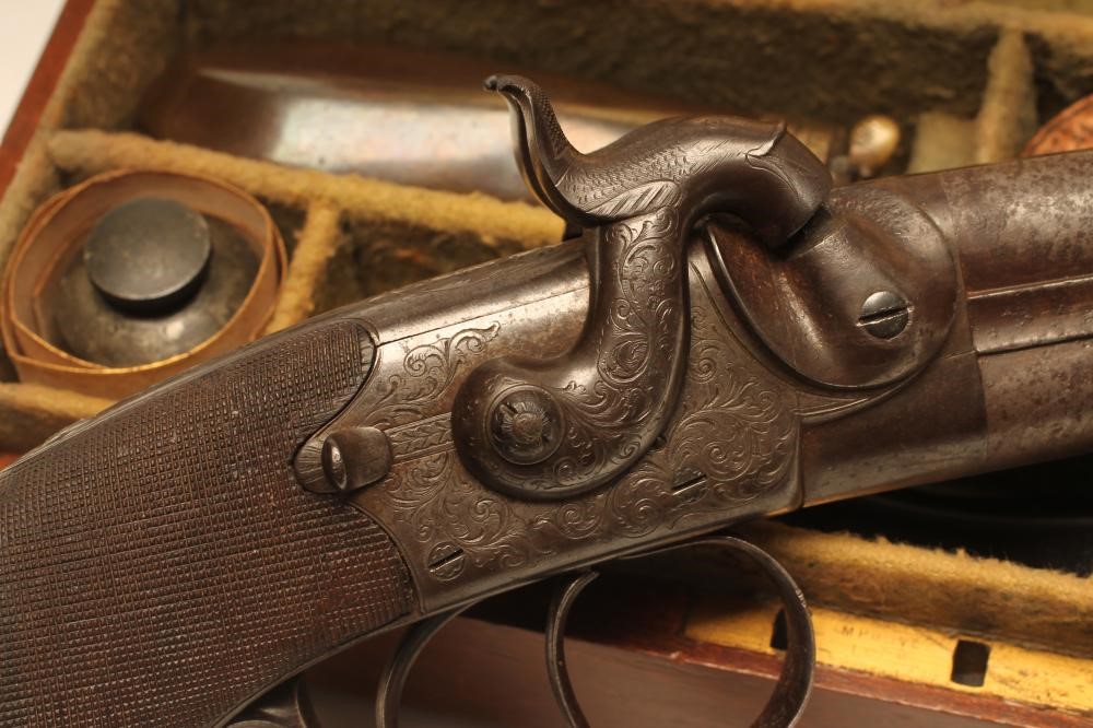A DOUBLE BARRELLED OVER & UNDER PERCUSSION PISTOL by W. Jackson Image
