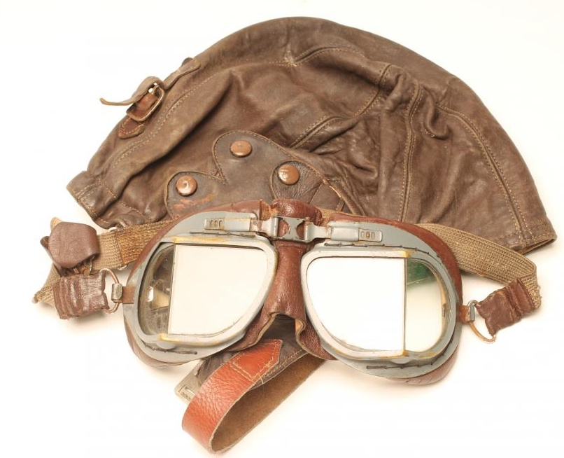 A PAIR OF BRITISH FLIGHT GOGGLES with painted brass frames and leather padding Image