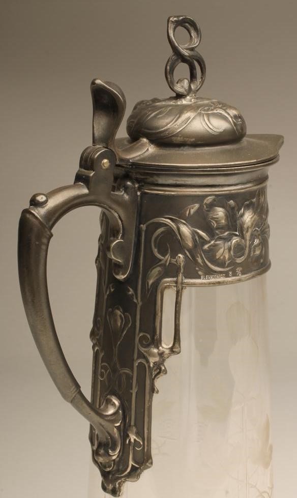 AN ART NOUVEAU PLEWKIEWICZ PEWTER MOUNTED CLARET JUG Image