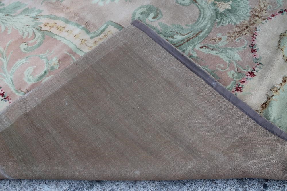 A SAVONNERIE STYLE MACHINE WOOL CARPET Image