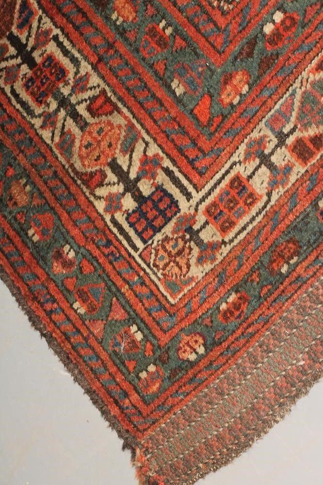 A PERSIAN TRIBAL RUG Image