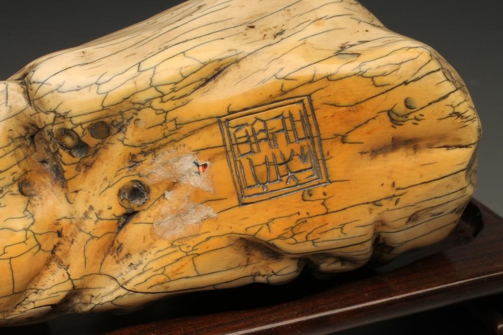 A CHINESE IVORY FIGURE carved as sleeping bearded men Image