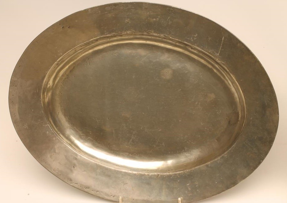A GEORGIAN PEWTER CHARGER of plain rim form with ownership initials to rear Image