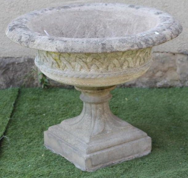 A LARGE HADDONSTONE URN of wide shallow form with everted rim and basket weave banding Image