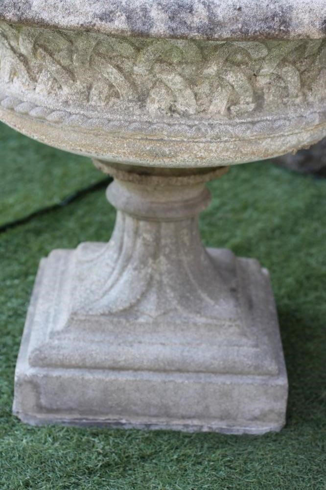 A LARGE HADDONSTONE URN of wide shallow form with everted rim and basket weave banding Image