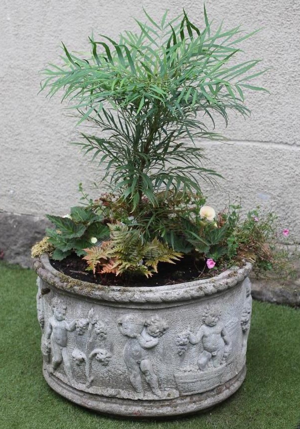 A COMPOSITION STONE PLANTER of circular form Image