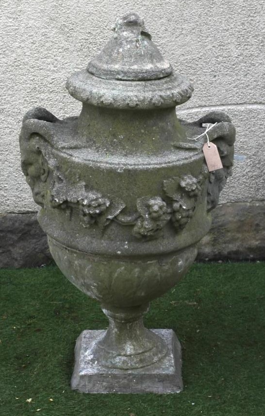 A COMPOSITION STONE URN FINIAL of ovoid form with flower finial on domed lid Image