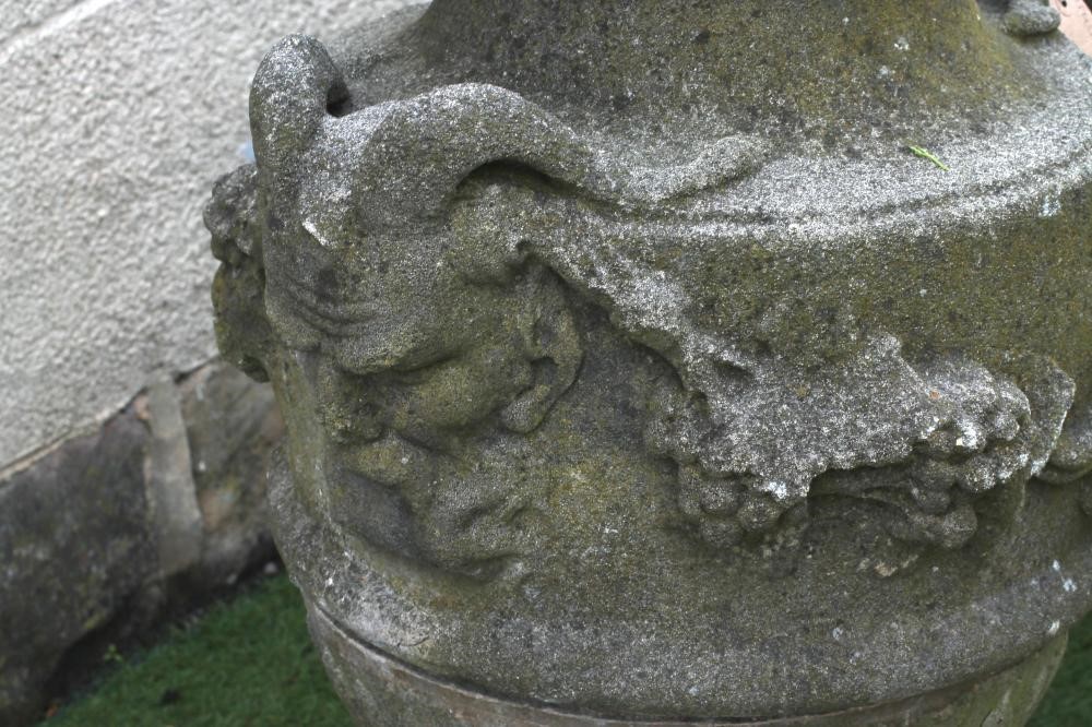A COMPOSITION STONE URN FINIAL of ovoid form with flower finial on domed lid Image