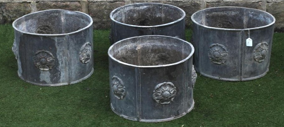 A SET OF FOUR LEAD PLANTERS Image