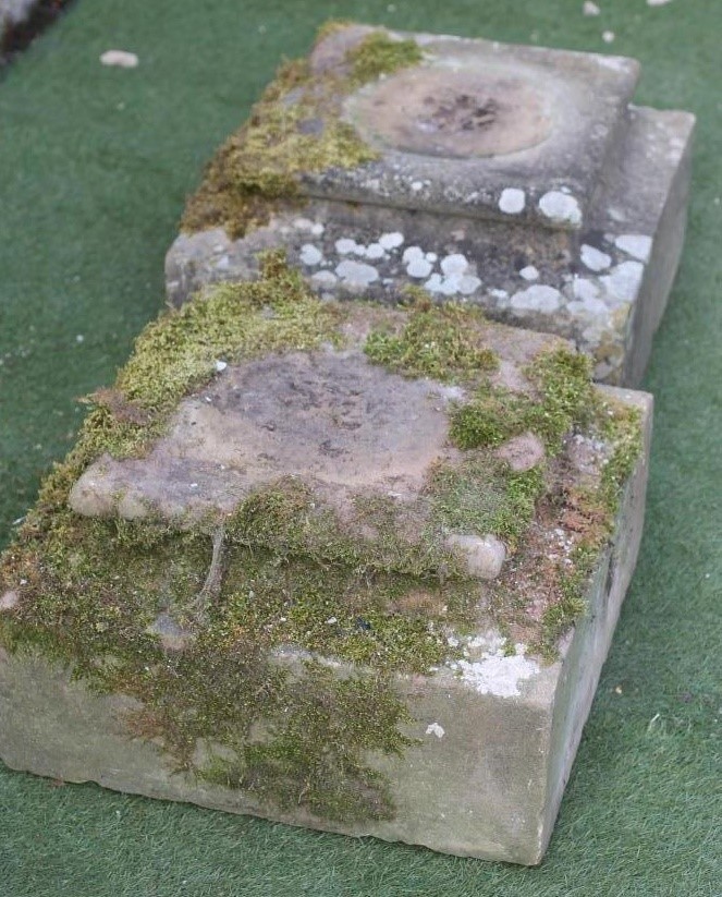 A PAIR OF SANDSTONE PLINTHS of shallow square form with cushion moulded top and waisted centre Image