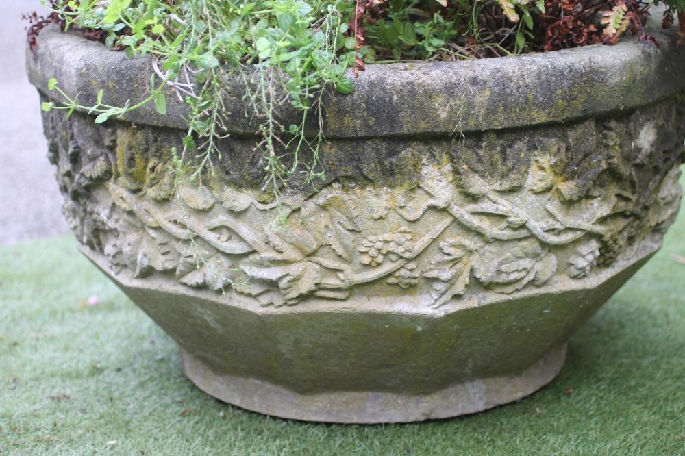 A COMPOSITION STONE PLANTER of faceted circular form Image