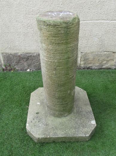 A SANDSTONE CYLINDRICAL COLUMN on a canted square base Image
