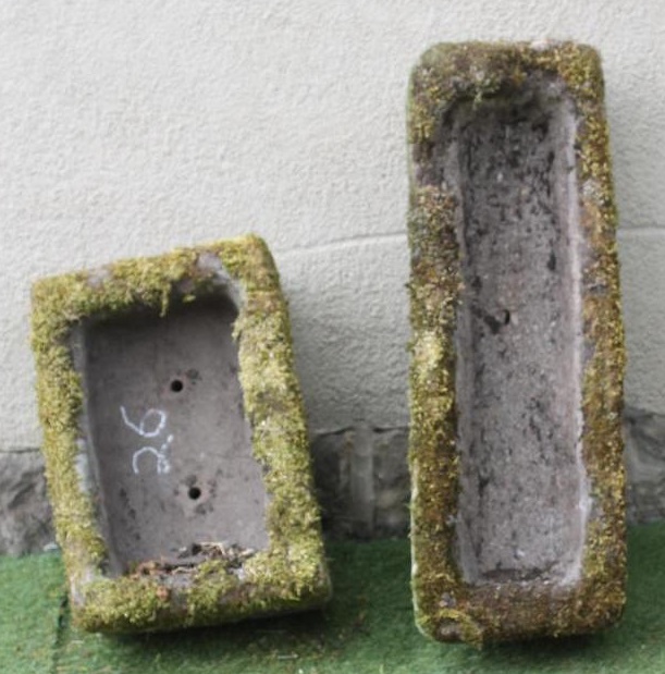 A SMALL SANDSTONE TROUGH of rough hewn oblong form Image