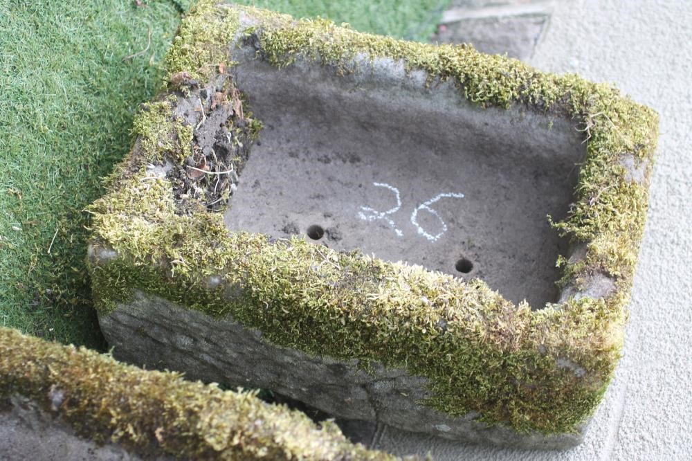 A SMALL SANDSTONE TROUGH of rough hewn oblong form Image