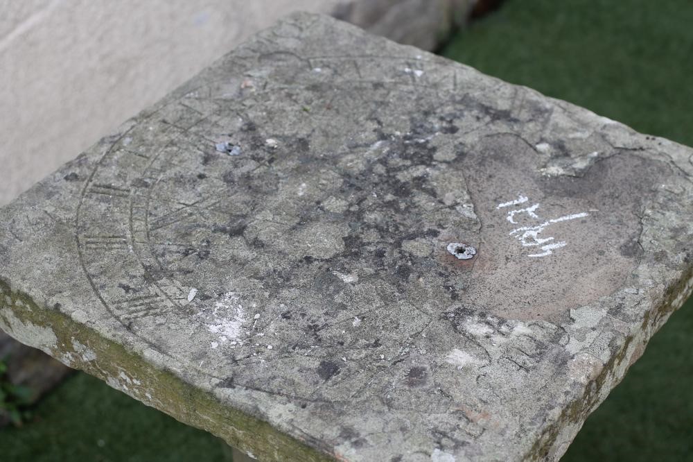 A SANDSTONE WALL SUNDIAL Image