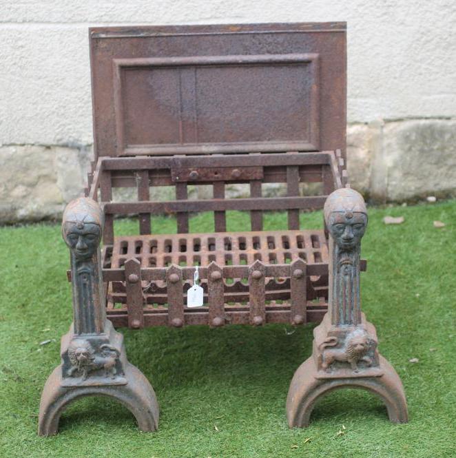 A PAIR OF WROUGHT AND CAST IRON FIRE DOGS Image