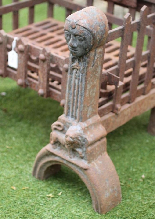 A PAIR OF WROUGHT AND CAST IRON FIRE DOGS Image