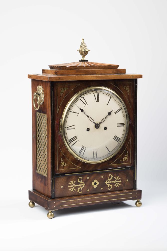 A REGENCY MAHOGANY AND BRASS INLAID BRACKET CLOCK Image