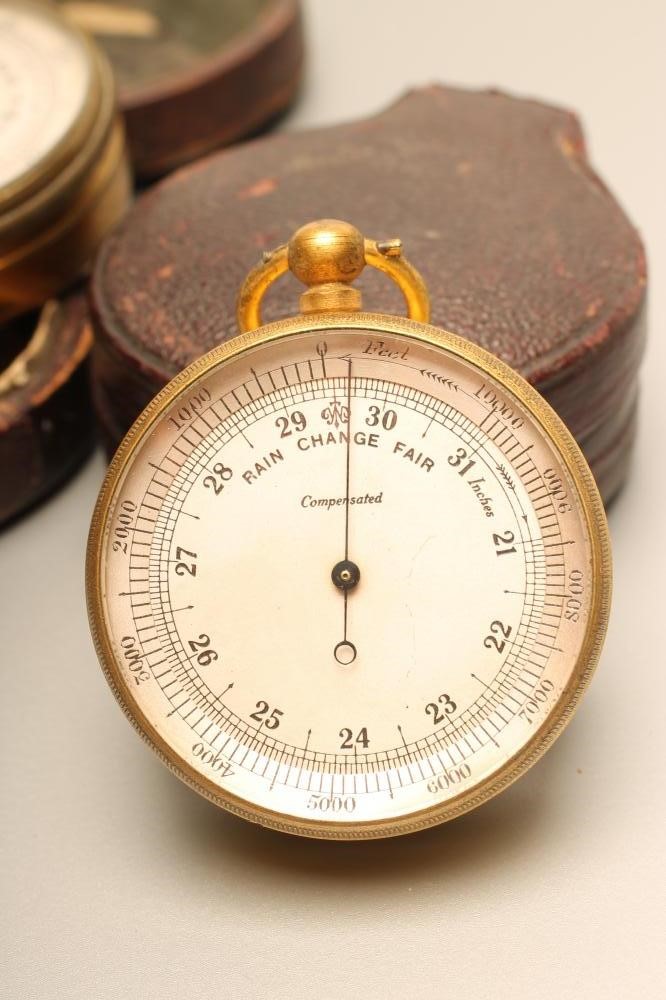 A VICTORIAN POCKET ANEROID BAROMETER Image