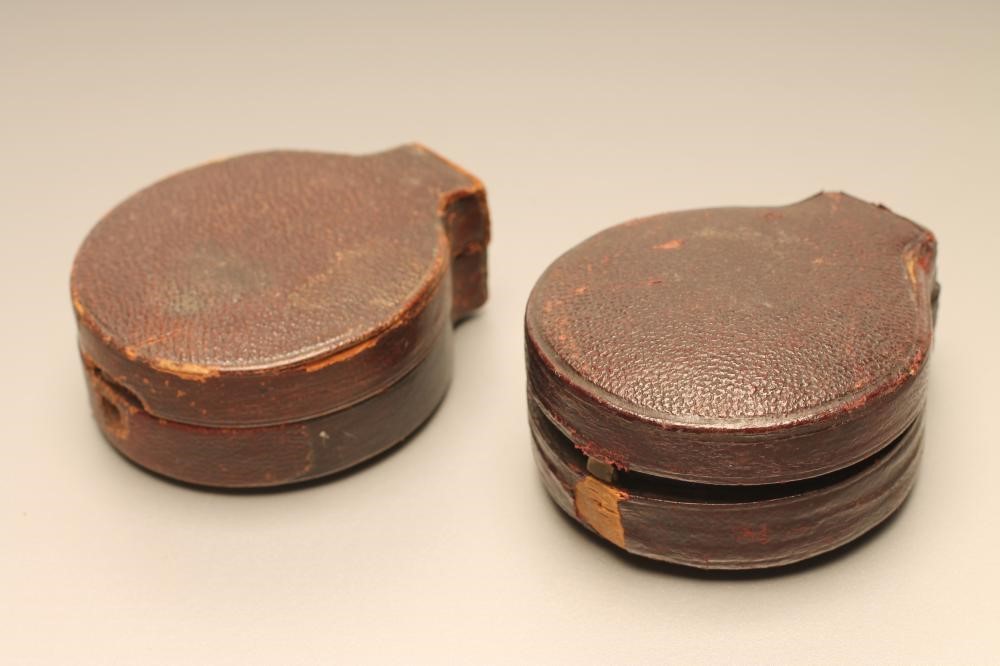 A VICTORIAN POCKET ANEROID BAROMETER Image