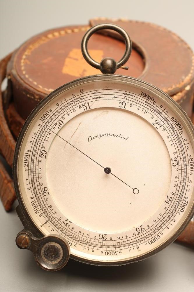 A LATE VICTORIAN POCKET ANEROID BAROMETER Image