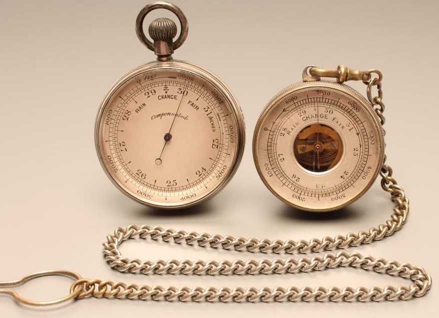 A VICTORIAN POCKET BAROMETER with keyless wind adjuster in engine turned silver case Image