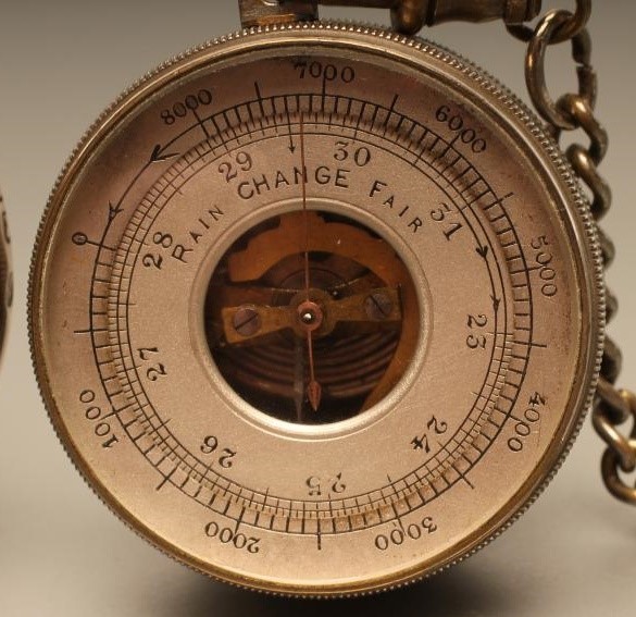 A VICTORIAN POCKET BAROMETER with keyless wind adjuster in engine turned silver case Image