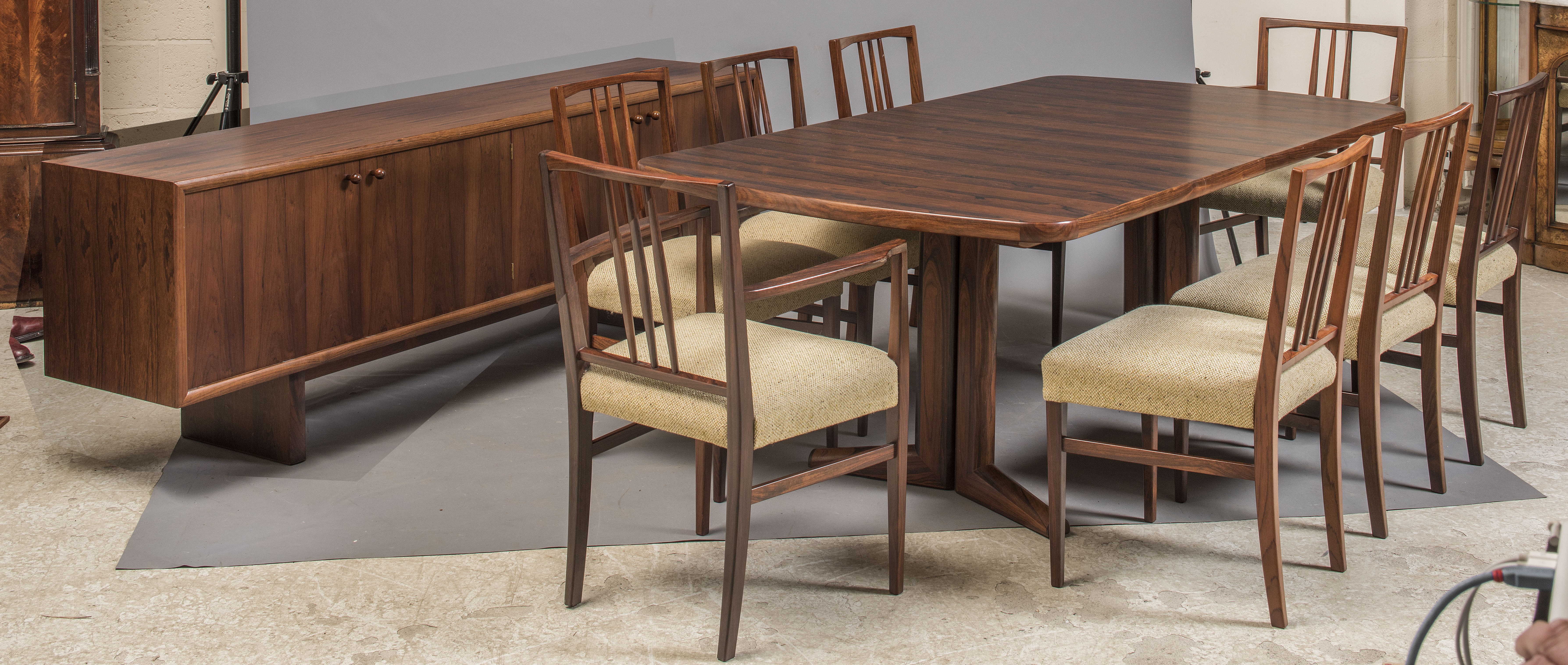 A GORDON RUSSELL "BRAZILIAN" ROSEWOOD DINING SUITE comprising rounded oblong extending Marlow dining Image