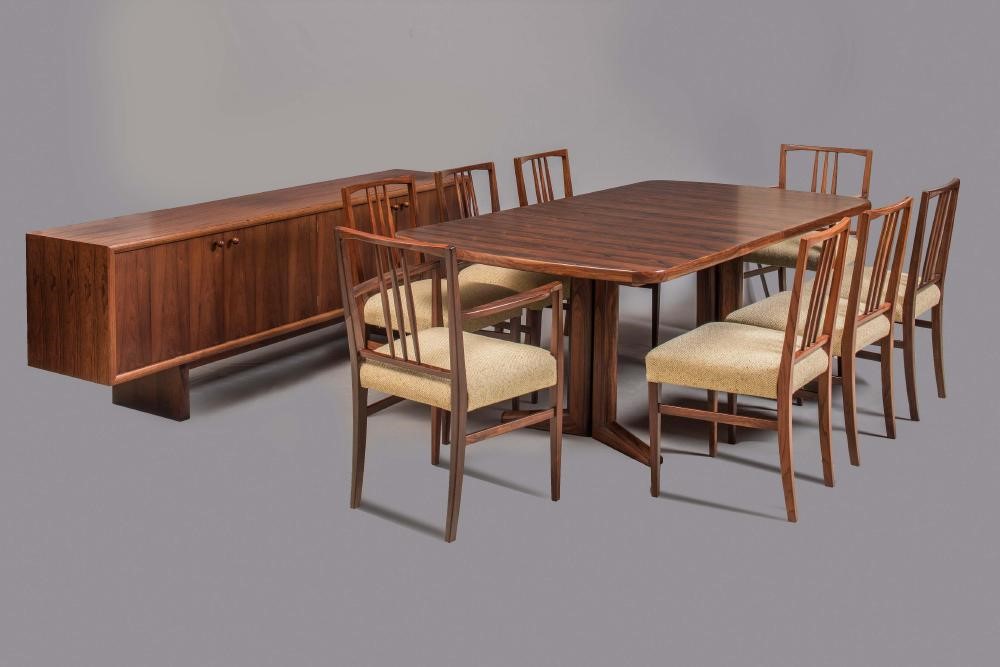 A GORDON RUSSELL "BRAZILIAN" ROSEWOOD DINING SUITE comprising rounded oblong extending Marlow dining Image