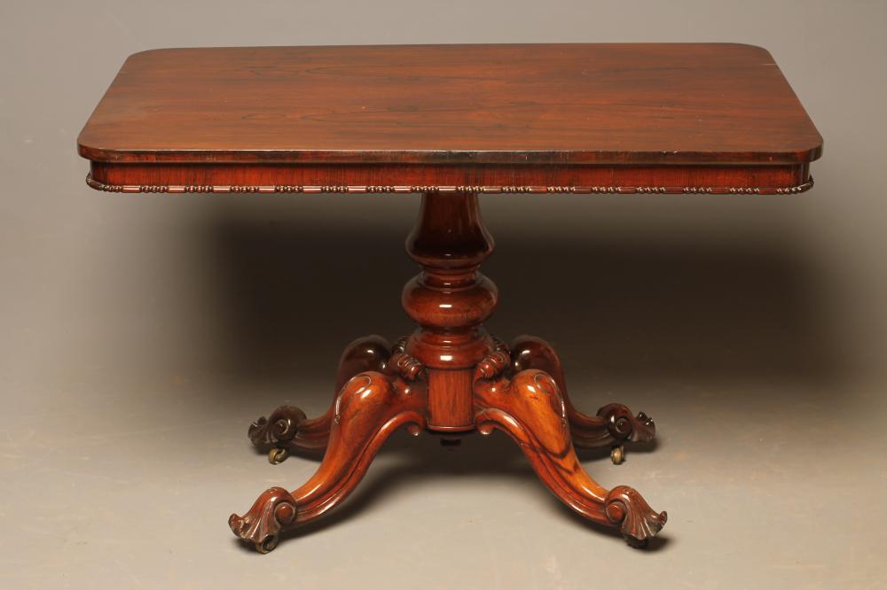 A VICTORIAN ROSEWOOD LIBRARY TABLE Image