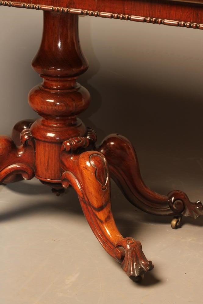 A VICTORIAN ROSEWOOD LIBRARY TABLE Image