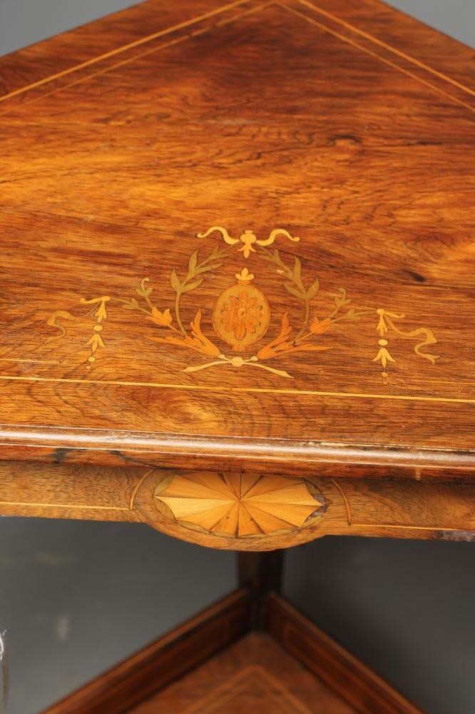 A LATE VICTORIAN ROSEWOOD CORNER TABLE of canted form with stringing Image
