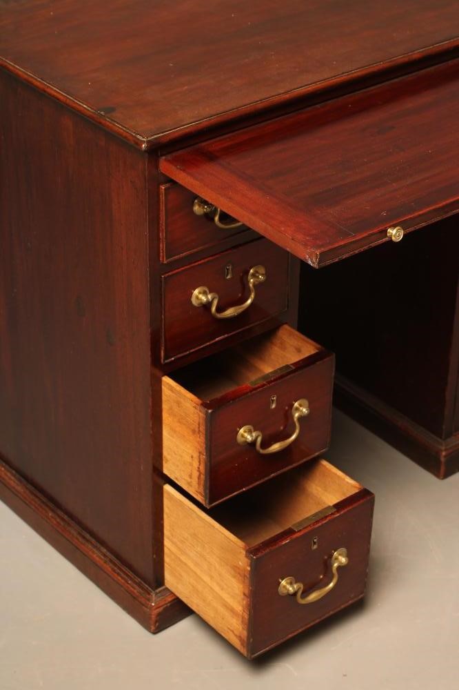A SMALL MAHOGANY KNEEHOLE DESK Image