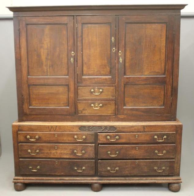 AN EARLY GEORGIAN JOINED OAK PRESS CUPBOARD Image
