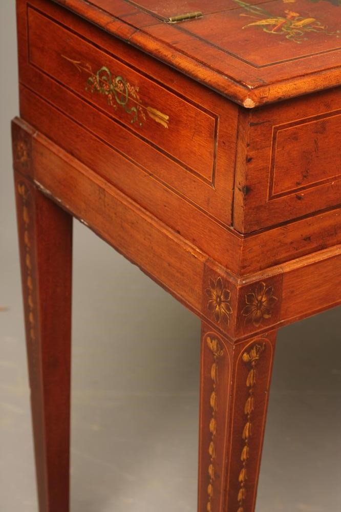 A LADY'S MAHOGANY DESK of oblong form painted with floral swags and musical trophies and with Image