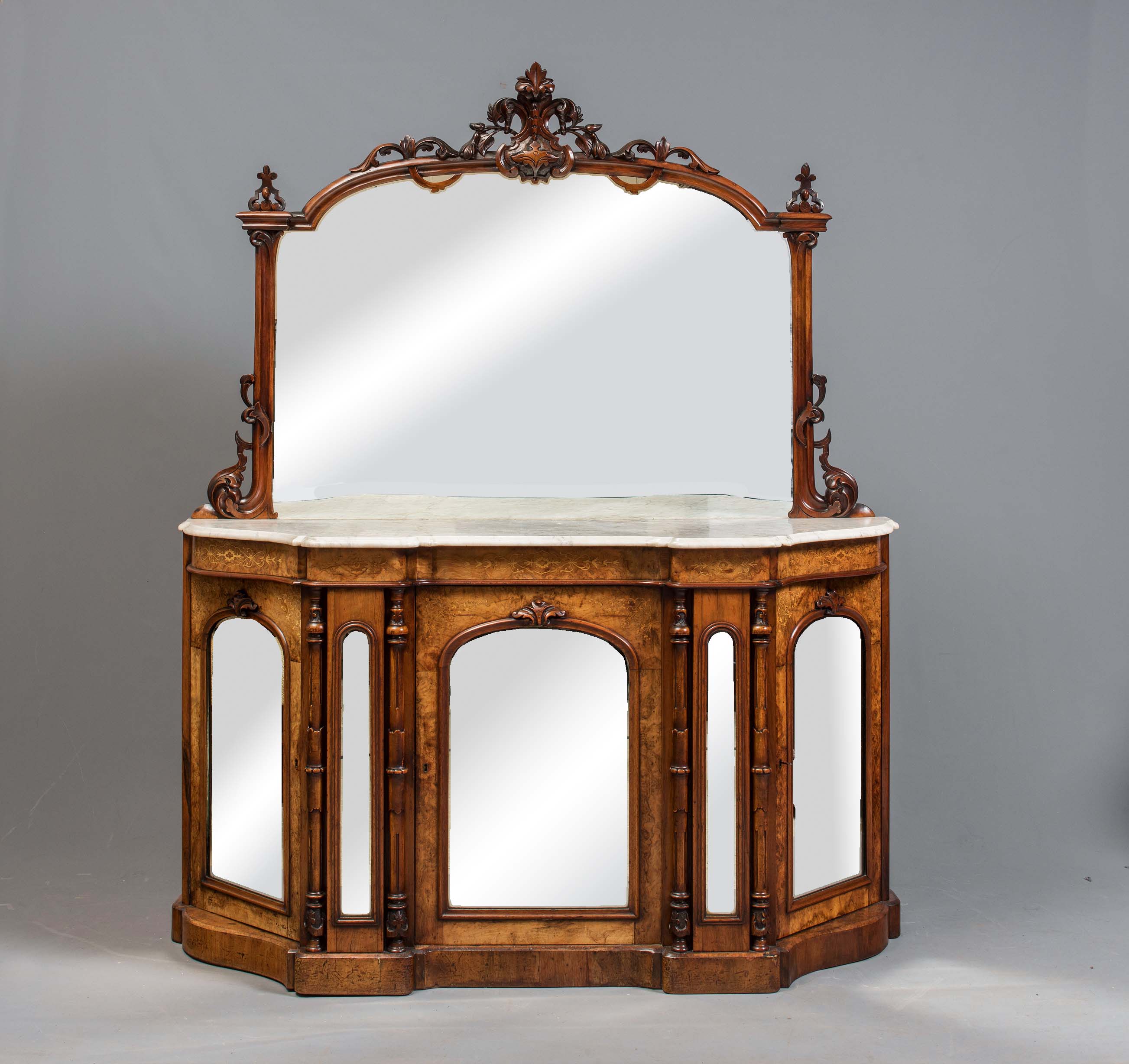A VICTORIAN WALNUT AND MARQUETRY CREDENZA of serpentine outline with veined white marble top Image