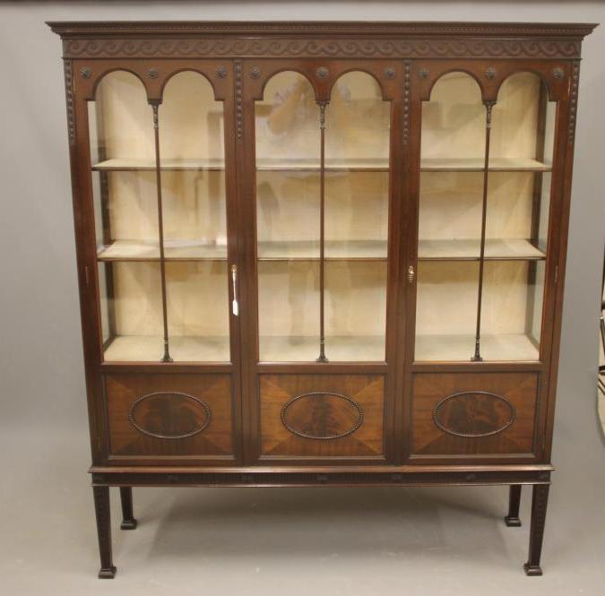 A MAHOGANY DISPLAY CABINET Image