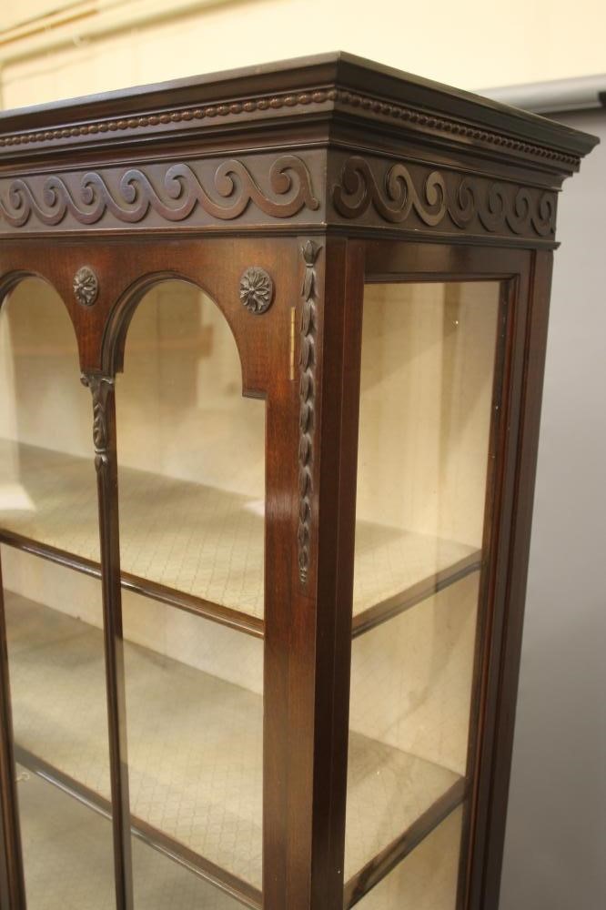 A MAHOGANY DISPLAY CABINET Image