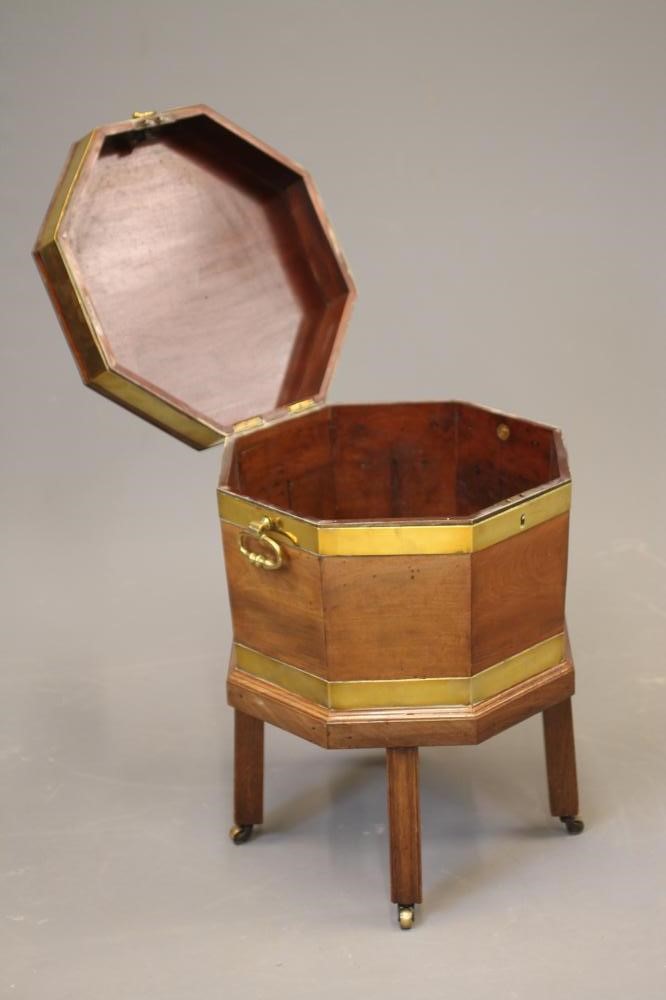 A GEORGIAN MAHOGANY AND BRASS BOUND CELLARETTE of octagonal form Image
