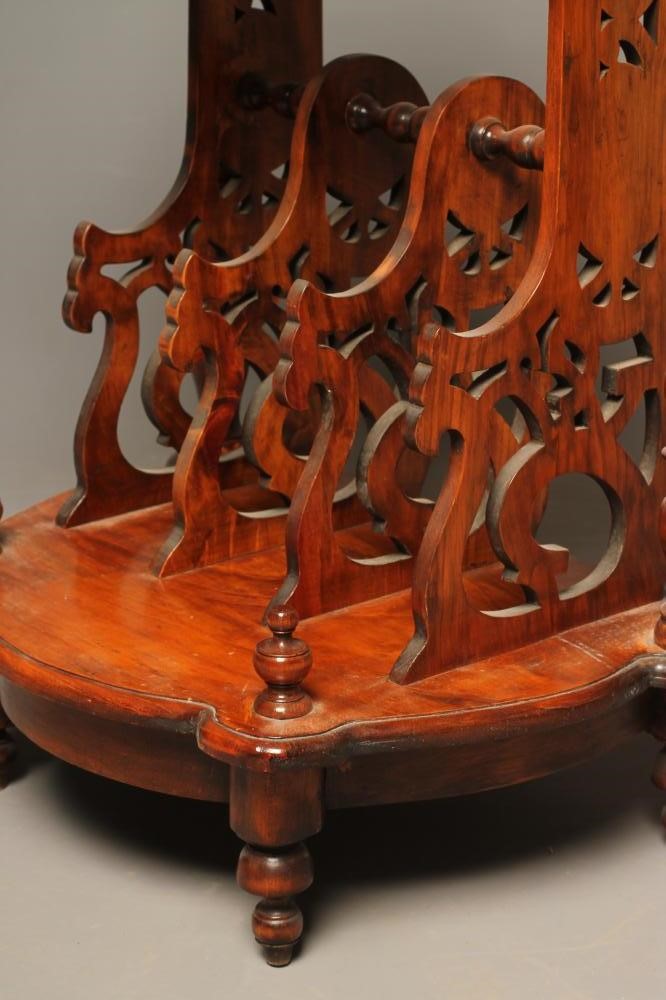 A VICTORIAN WALNUT CANTERBURY of shaped D form Image