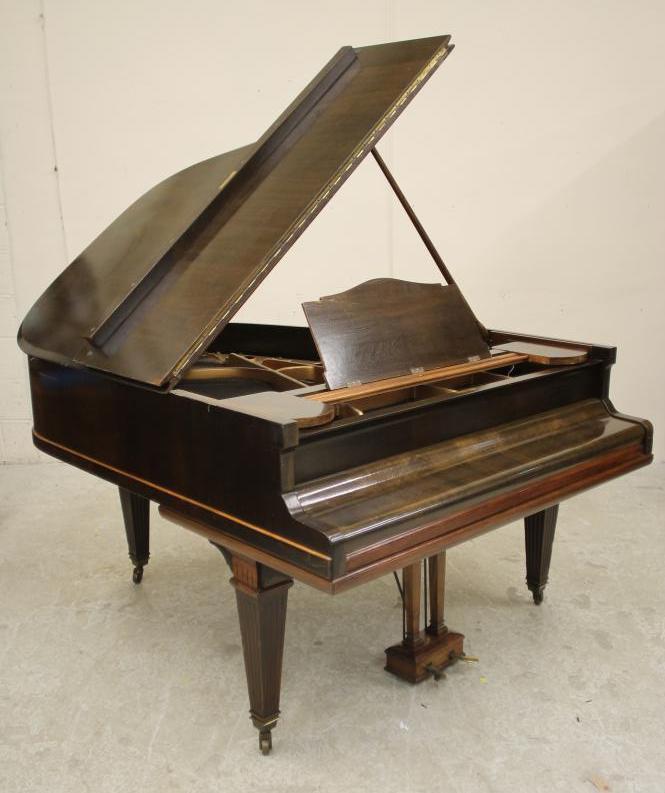 A MAHOGANY BABY GRAND PIANO by Weber Image