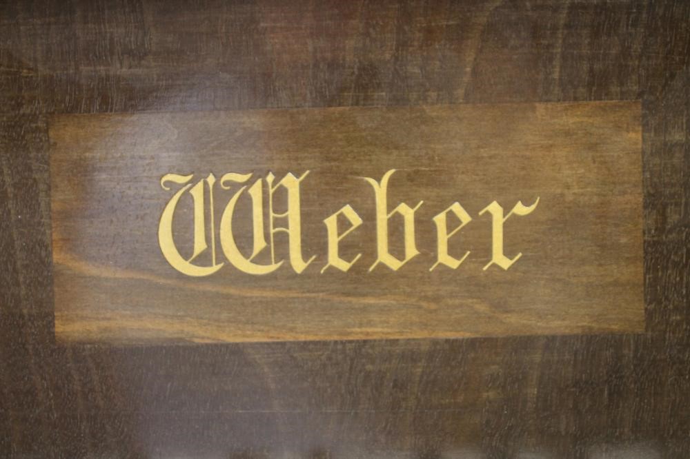 A MAHOGANY BABY GRAND PIANO by Weber Image