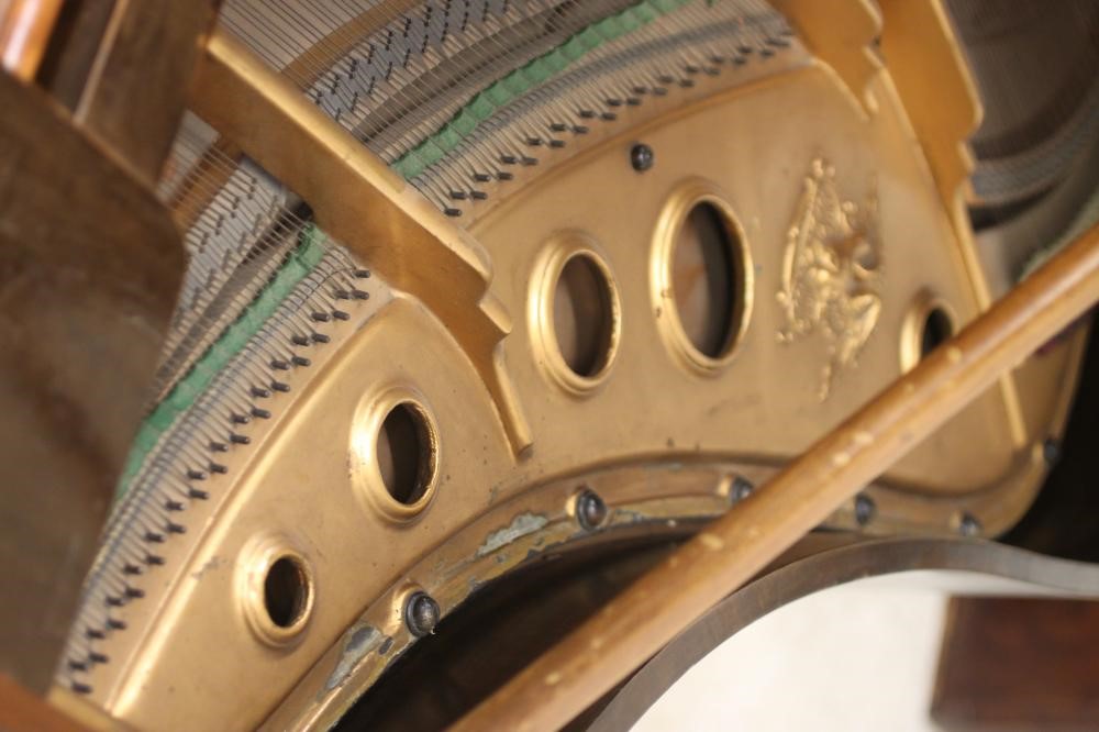 A MAHOGANY BABY GRAND PIANO by Weber Image