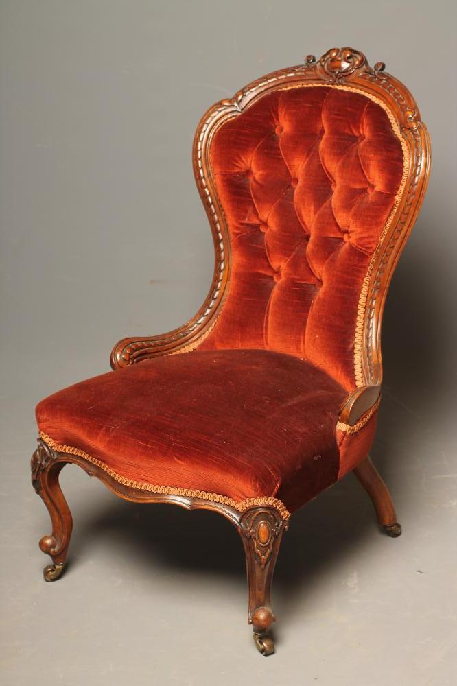 A VICTORIAN WALNUT FRAMED NURSING CHAIR of spoonback form Image